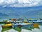 Coloured boats on the lake, Pokhara, Nepal, mountains and cloudscape