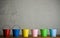 Coloured buckets in line on the floor
