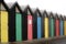 Coloured doors on beach huts in a row