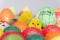 Coloured easter eggs and baby toy chick