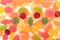 Coloured fruit marmalade. Lemon, apple, orange, grapefruit. Jelly colour background