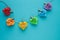 Coloured hearts hung on rope with wooden clips on a blue background. Copy space. Valentine`s Day concept. LGTB gay concept