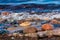 Coloured pebbles at the shoreline with water and waves