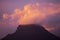 Coloured purple violet sunset at the muntain with white clouds above - beautiful mounts landscape with amazing colors - concept of