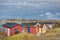 A coloured village depicts lots Nordic summerhouses Swedish sommarstuga or stuga by the sea in a colourful fishermen harbour