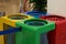 Coloured waste containers to indicate the different types of recycling materials, depending on the type of waste and in yellow,