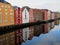 Coloured wooden warehouses Trondheim reflected in water