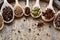 Colourful aromatic various spices for cooking on old wooden barrel, close-up, flat lay, selective focus, copy space.