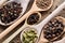 Colourful aromatic various spices for cooking on old wooden board, close-up, flat lay, shallow depth of field.