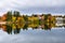 Colourful Autumnal Trees Reflecting in Water