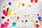 Colourful balloons against a vibrant white background - AI Generated