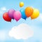 Colourful balloons in a cloudy sky