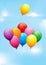 Colourful balloons in a cloudy sky