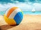 Colourful beach ball on the sand