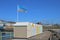 Colourful beachhuts on harbour breakwater