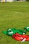 Colourful bibs left on a football pitch.