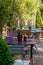 Colourful bistro tables and chairs belonging at a cafe in a garden at Hartley Wintney, Hampshire, UK.
