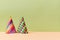 Colourful bright head caps isolated on green background. Celebration. Party and festive holiday concept. Copy space