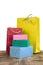 Colourful and bright shopping packages and boxes on wooden table