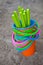 Colourful buckets on a sandy beach