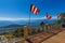Colourful Buddhist Prayer flags are waving in strong wind under sunshine at Samdruptse, huge buddhist memorial Monastery in Sikkim