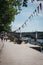 Colourful bunting on the riverbank along the River Thames in Richmond, London, UK.