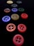 Colourful buttons on black background