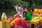 Colourful canal parade of flower and vegetables decorated boats with cheerful dressed up singing and dancing people