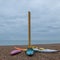 Colourful canoes on pebbly beach at Hove, East Sussex, UK. Photographed on a cold, calm winter`s day.