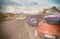 Colourful cars parked on a mountain road