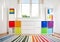 Colourful children rooom with white walls and furniture