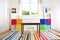 Colourful children rooom with white walls and furniture