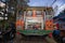 colourful chiva bus on narrow street