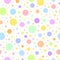 Colourful circles seamless pattern on an off-white background.