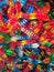 A colourful close up of a pile of big gummy worm candies