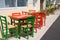 Colourful, colored wooden bistro tables and chairs in Giardini Naxos near Taormina, Sicily