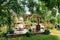 Colourful decorated table in summer setting. Garden party. Lunch. Summer garden patio terrace.