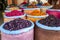 A colourful display of sacks containing various grains, herbs and spices for sale in the Marrakesh medina, Morocco.