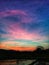 Colourful evining sky with paddy field and water