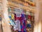 Colourful exotic textile for sale in bamboo shed, medium view. Bedouin market in egyptian desert. Selective soft focus