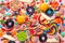 colourful festive sweets and candies like background, top view