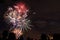 Colourful Fireworks with Silhouette of People Watching the Display