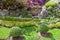 Colourful Flowerbeds and Winding Grass Pathway