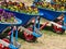 Colourful Flowers Growing in Blue Wheel Barrows