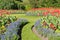 Colourful Flowers and Lawn Pathway in a Formal Garden