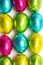 Colourful foil wrapped easter eggs overhead shot