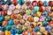 Colourful gemstones as hearts on a white background