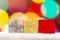 Colourful Gif boxes Presents on snow with a bokeh Background