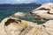 Colourful Granite Coastline & Isola Caprera With Blue Sky â€“ Baia Sardinia, Costa Smerelda, Sardinia, Italy.