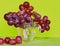 Colourful grape on yellow background. Creative fruits composition. Healthy ingredients. Vegan food.